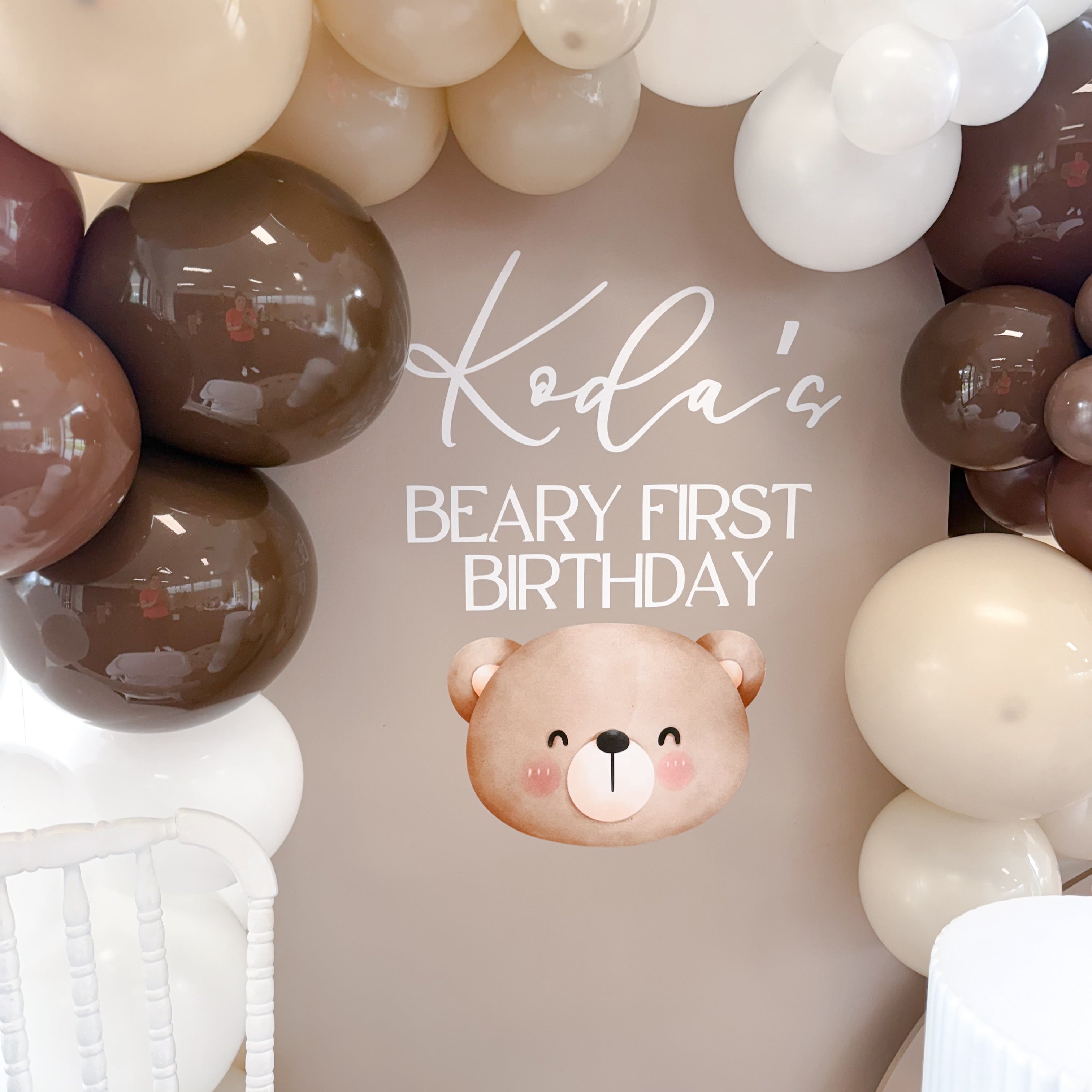 Neutral and brown balloon garland with teddy bear accents for BEARy First Birthday