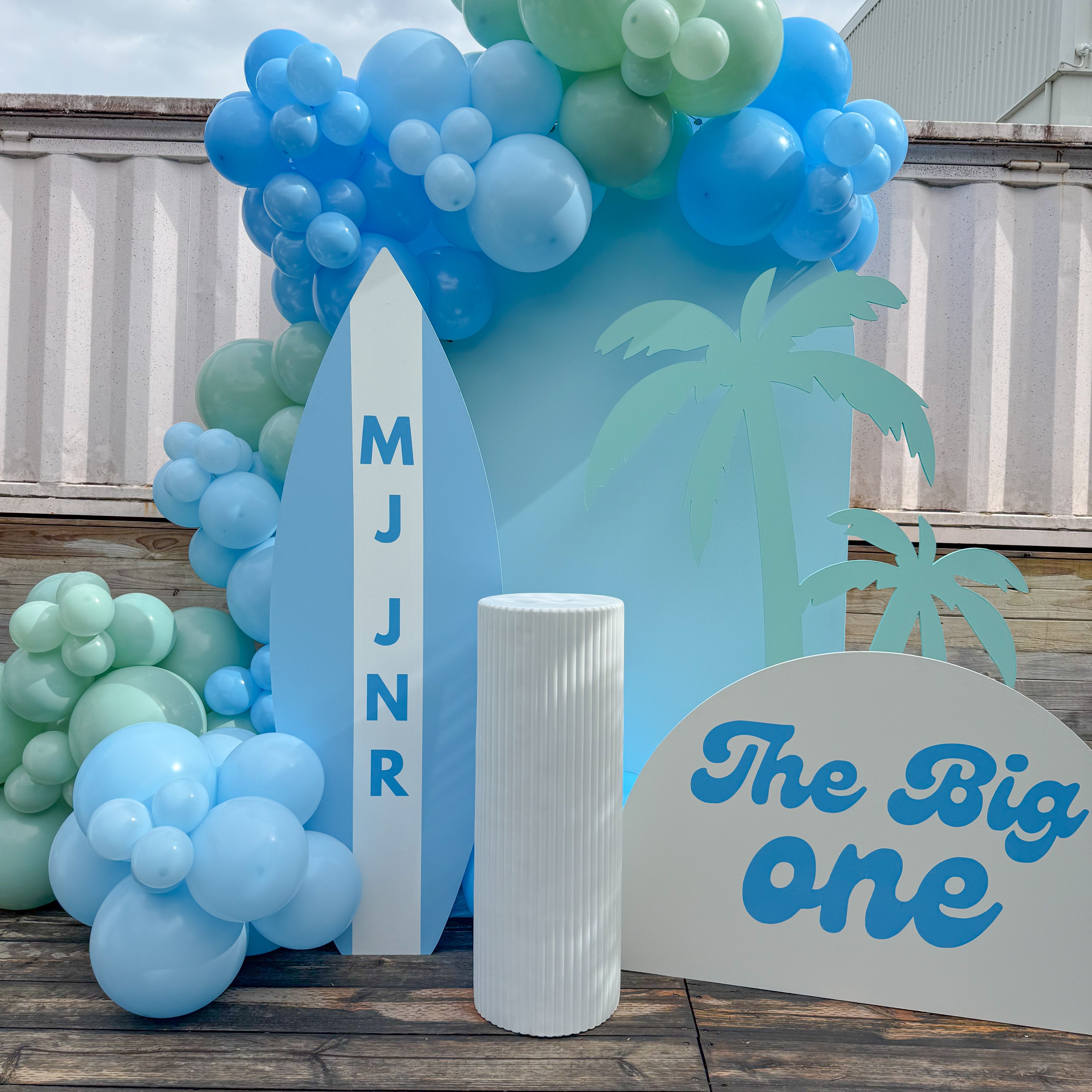 Surf themed birthday party setup with custom balloon garland, beach backdrop, and event styling on the Gold Coast