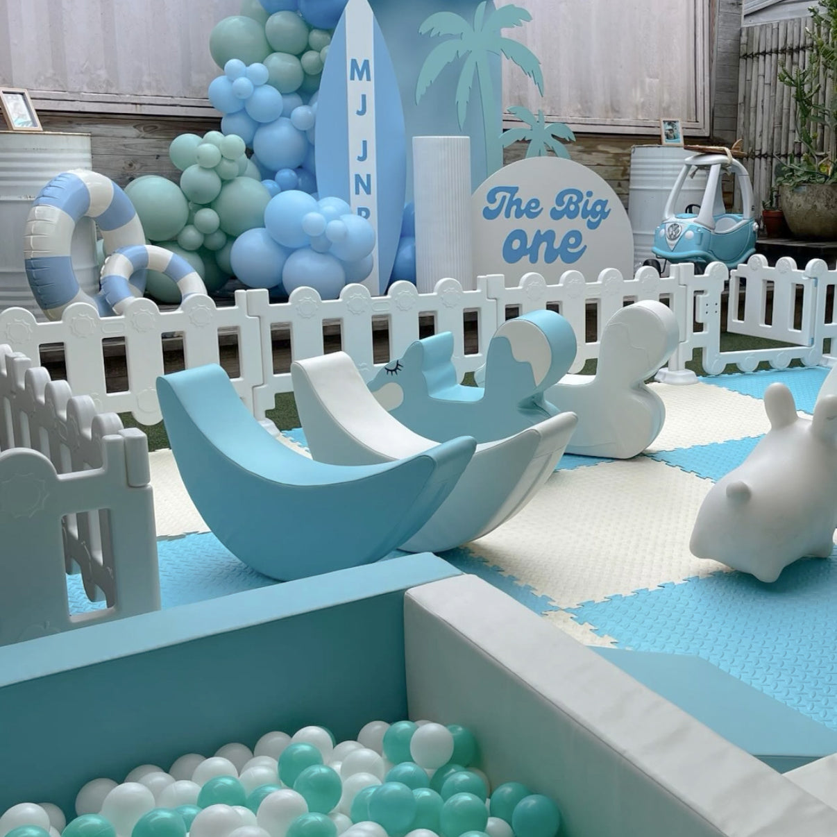 Surf themed birthday party setup with custom balloon garland, beach backdrop, and event styling on the Gold Coast