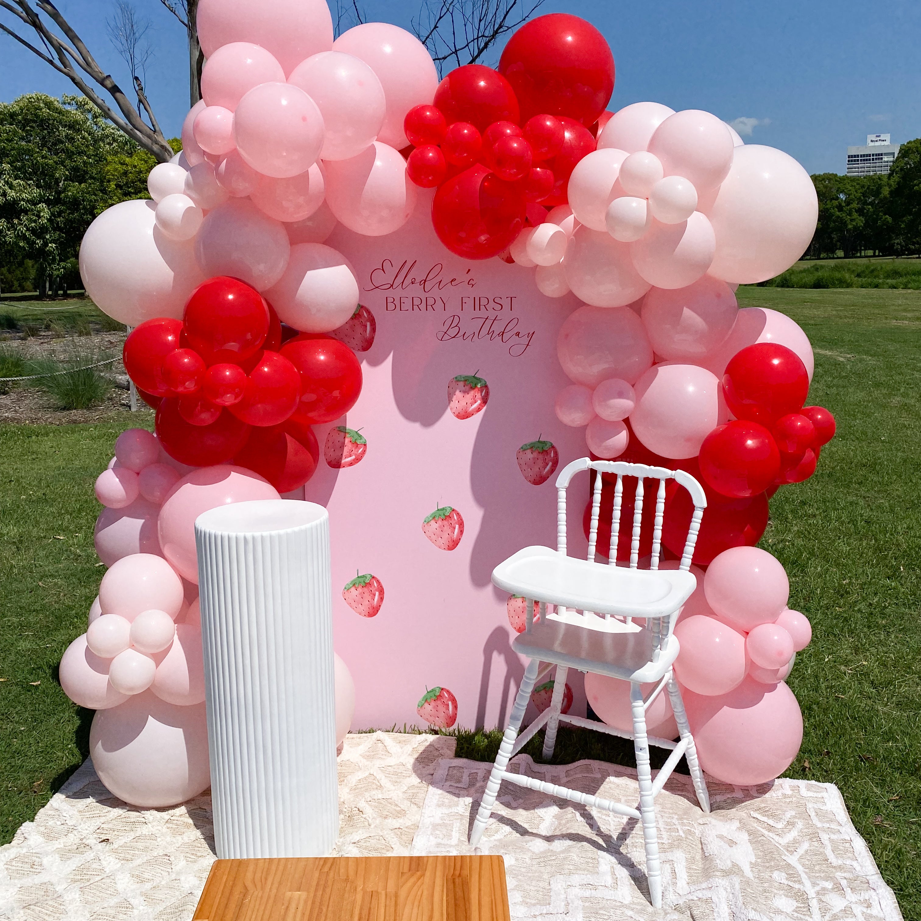 Complete Berry First Birthday event styling with balloons, backdrop, and props on the Gold Coast