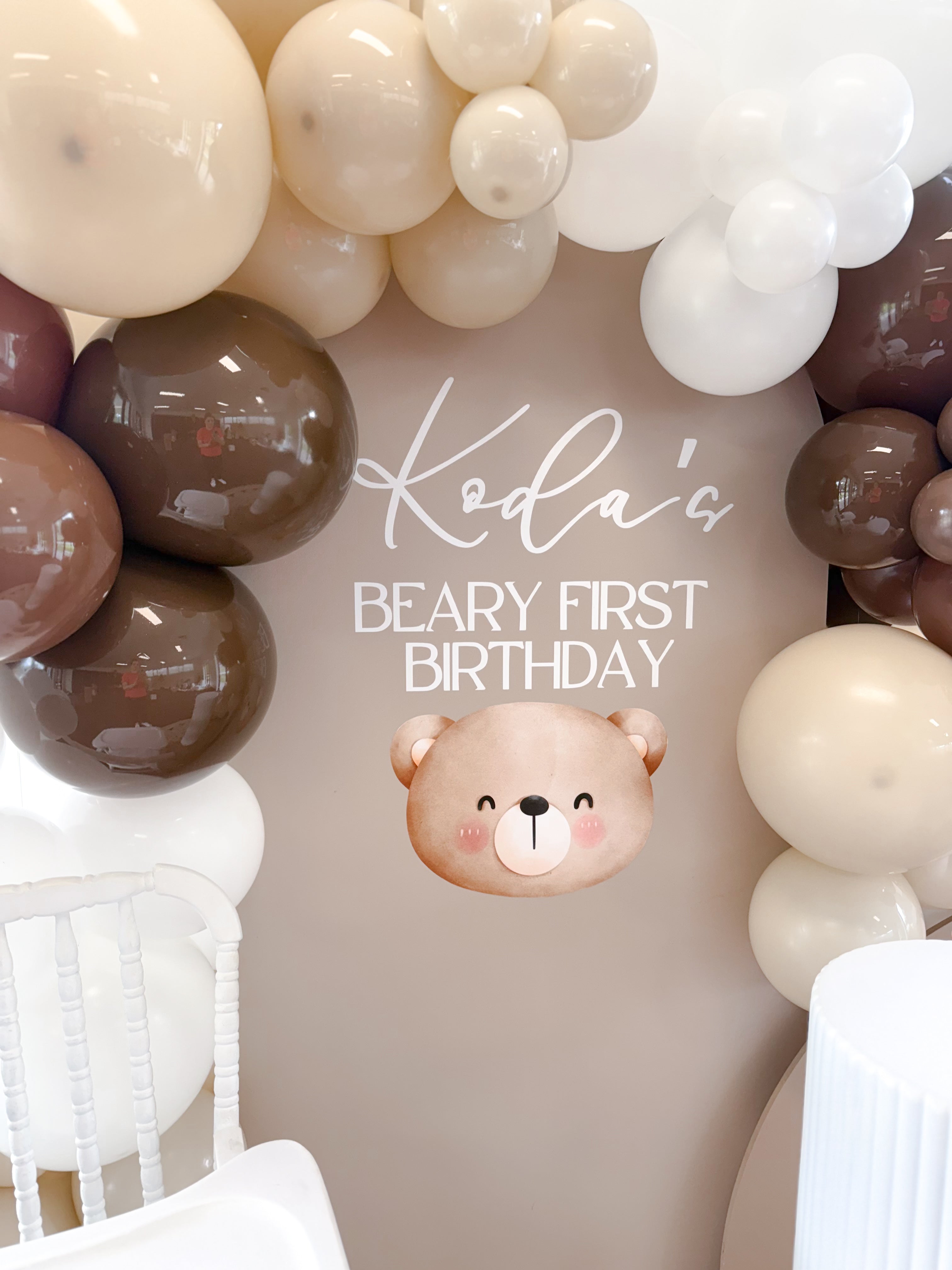 Neutral and brown balloon garland with teddy bear accents for BEARy First Birthday