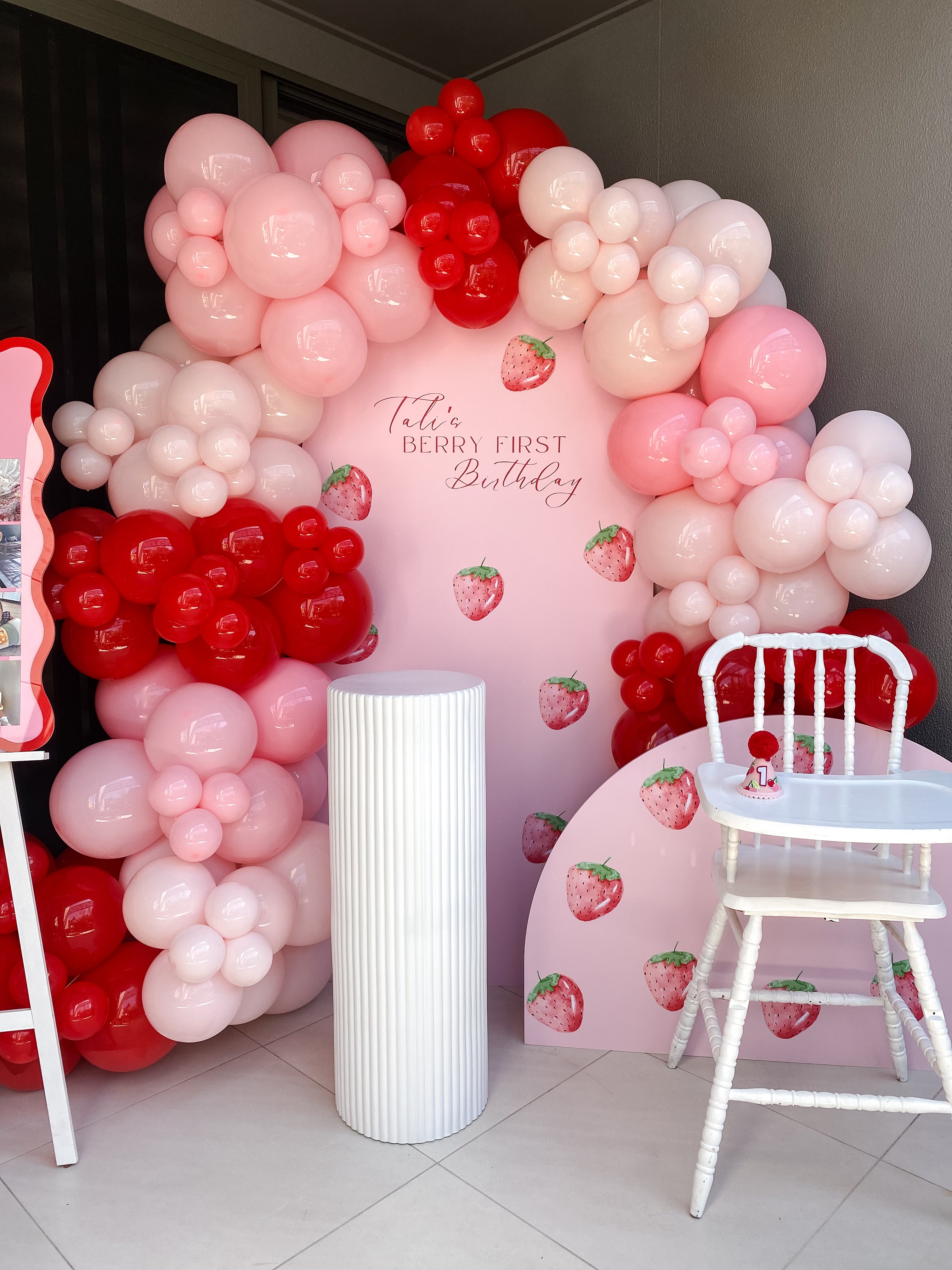 Berry First Birthday party package with balloon garland, berry-themed backdrop, and custom event styling on the Gold Coast